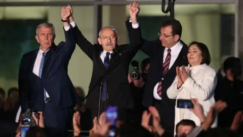 NECATI SAVAS/EPA-EFE/REX/Shutterstock Kemal Kilicdaroglu here (C) with his wife Selvi (R), Istanbul Mayor Ekrem Imamoglu (2-R) and Ankara Mayor Mansur Yavas (L) on 6 March