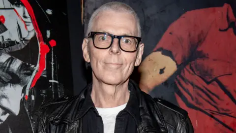 Getty Images Andy Rourke of The Smiths attends the "Meet Me In The Bathroom" New York premiere at Webster Hall on October 30, 2022 in New York City