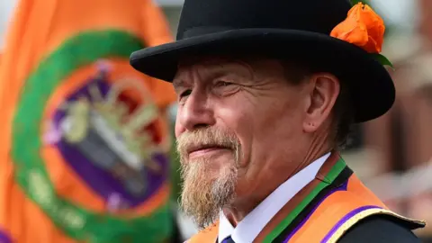 Pacemaker A member of the Orange Order taking part in a march on 12 July