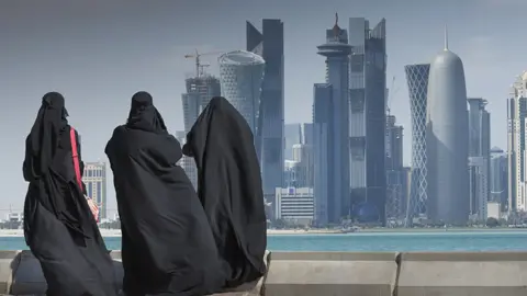 Getty Images Qatar skyline with people in foreground