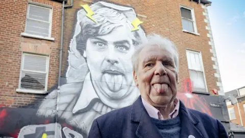Linen Quarter Terri Holey at belfast mural in his honour