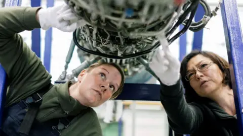 Getty Images Women inspecting aircraft parts