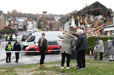 PA Media Locals survey the damage on Saturday
