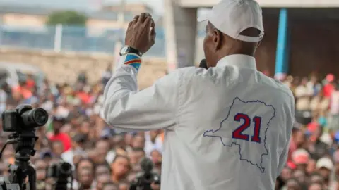 Reuters Congolese Presidential candidate Martin Fayulu addresses his supporters during a campaign rally in Goma, North Kivu province, Democratic Republic of the Congo, November 30, 2023