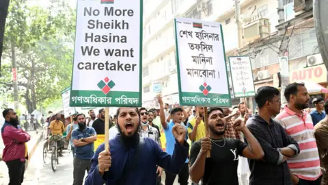 Getty Images Members Of The Gono Odhikar Parishad Held A Demonstration With Banner During On The Second Day Of 48-hours Nationwide Blockade In Dhaka, Bangladesh, On November 27, 2023
