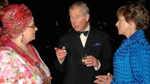 Getty Images Prince Charles, Prince of Wales chats to founder Camila Batmanghelidjh (L) at a Kids Company dinner on May 14, 2008 in London, England.