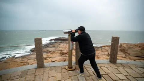 Joyce Liu/BBC Man looks towards Taiwan