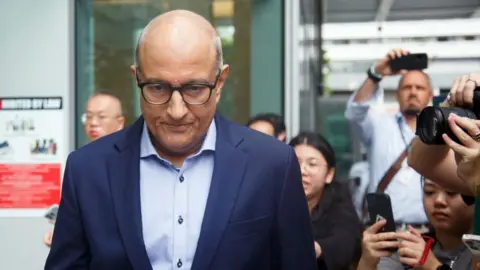 Getty Images S Iswaran, Singapore's former transport minister, leaves the Singapore State Courts in Singapore, on Thursday, Jan. 18, 2024.