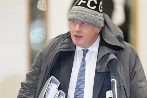 Getty Images Messages show that Ms Sturgeon described former prime minister Boris Johnson as a "clown"