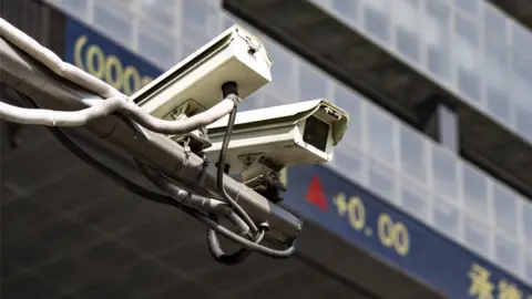 Getty Images A surveillance camera outside the Shenzhen Stock Exchange building.