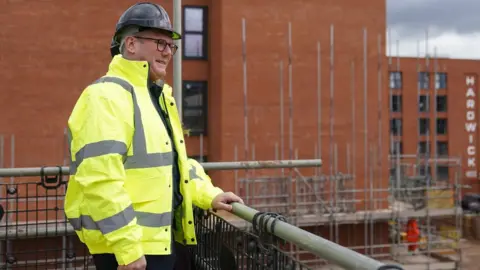 PA Media Sir Keir Starmer during a visit to a housing development in the Nightingale Quarter of Derby on Friday
