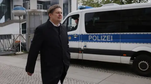 Sean Gallup/Getty Images Maximilian Krah, member of the European Parliament for the far-right Alternative for Germany (AfD) political party, departs after speaking to journalists outside the Reichstag following a meeting between Krah and AfD leading members on April 24, 2024