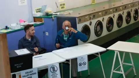 AFP Polling station in a laundrette