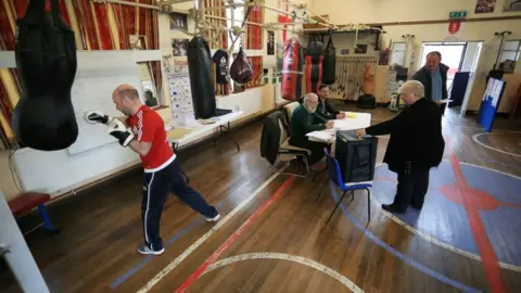 Getty Images People vote at the East Hull Boxing Club set up as a polling station in Kingston-Upon-Hull