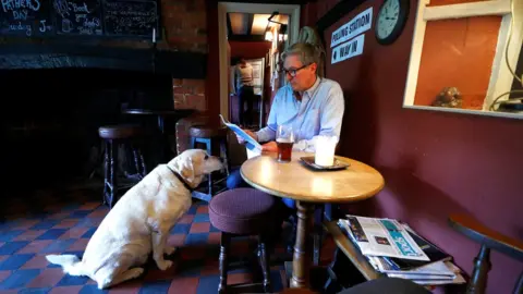 Reuters Dog and man in pub