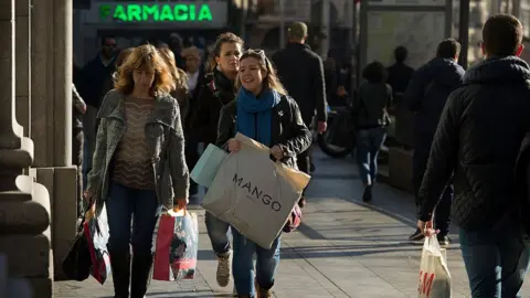 Reuters Shoppers in Spain