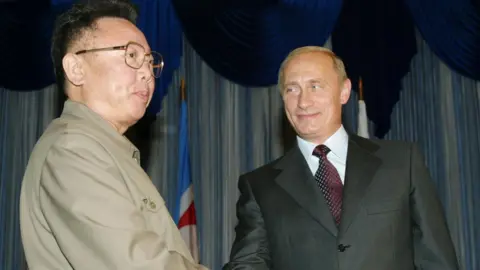 AFP Vladimir Putin meets Kim Jong-il in 2002