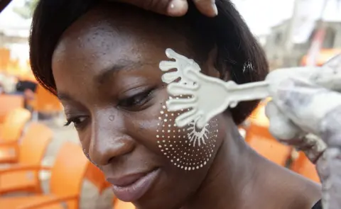 EPA Ivorians take part in the festival of Abissa in Grand-Bassam, Ivory Coast, 04 November 2017. The feast of the Abissa, a feast of rejoicing organized by the N"Zima community to symbolize the concepts of democracy and social justice. The N"Zima, a people of Ghanaian origin, finds herself around her leader and to the sounds of the tams-tams to take stock of the past year, and eventually denounce the injustices committed, or confess them publicly within the framework As part of a request for forgiveness to the people and an repentance. The festival of Abissa is celebrated each year between the end of October and the beginning of November.