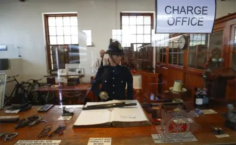 EPA A 1913-1957 era charge office on exhibit at the South African Police Service"s (SAPS) Heritage Services Museum in Muizenberg, Cape Town, South Africa 09 November 2017. South Africa has one of the highest violent crime rates in the world with a very high rate of murders, assaults, rapes and other crimes.The South African Police Service"s has released the crime statistics for 2017 showing as many as 2,129,001 serious crimes were recorded in 2017 an increase from 2015/16. The SAPS Heritage Services Museum dating back to before 1874 portrais various era"s of South African policing and documents famous crimes whilst also giving the visitor a view into a prison cell, courtroom and charge office