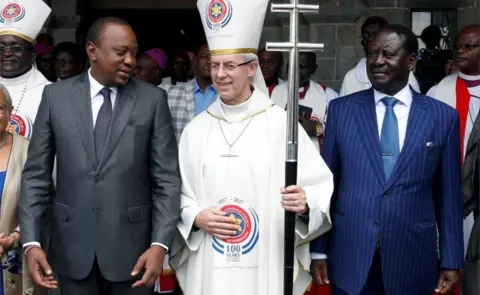 Reuters President Uhuru Kenyatta (L), Archbishop of Canterbury Justin Welby (C), and Kenyan opposition leader of the National Super Alliance (NASA) coalition Raila Odinga (R) pose for a photograph after a ceremony at the All Saints Anglican Church in Nairobi, Kenya November 5, 2017.