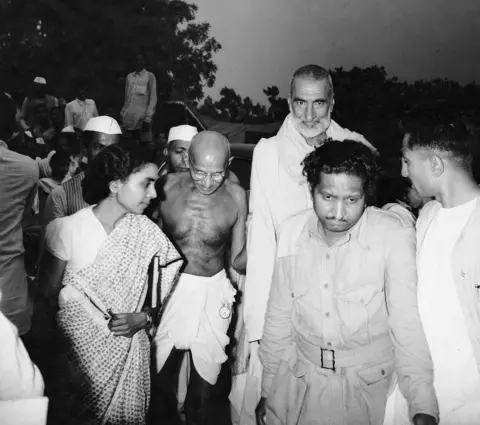 BBC Gandhi with Khan Abdul Ghafar Khan and Sushila Nayar, his personal physician, arrive for a meeting.