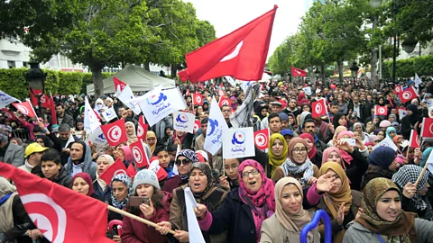 Alamy People celebrate the sixth anniversary of the Arab Spring in Tunisia; the country was the only one in the movement to move to parliamentary democracy (Credit: Alamy)
