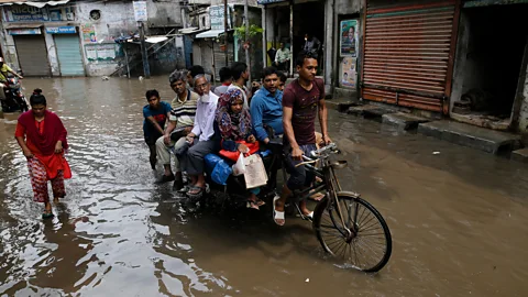 Getty Images Poorer people will bear a disproportionate burden of the worst effects of climate change, such as flooding (Credit: Getty Images)