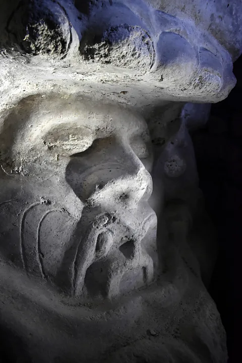 Amanda Ruggeri A frieze depicts the massive head of an Earth monster, its mouth open and teeth bared (Credit: Amanda Ruggeri)