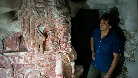 Amanda Ruggeri Francisco Estrada-Belli stands with a frieze of a king at Holmul (Credit: Amanda Ruggeri)