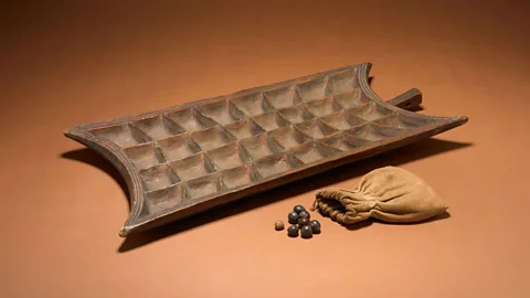 The Trustees of the British Museum/ CC BY-NC-SA 4.0 This modern example of a mancala game board comes from Uganda (Credit: The Trustees of the British Museum/ CC BY-NC-SA 4.0)
