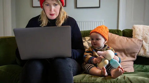 Alamy File image of a mum working next to her child