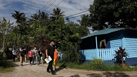 Edgar Su/Alamy Yap, who leads tours through the kampong, has noticed an increase in visitors in the past year (Credit: Edgar Su/Alamy)