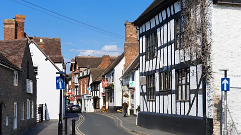 Ian Dagnall Commercial Collection/Alamy Shops on the High Street in the village of Much Wenlock, Shropshire, England